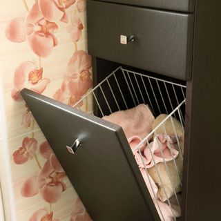 room with tiles and storage drawer