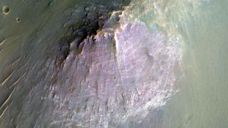 A top down photograph of a large purple-colored mountain on the surface of Mars