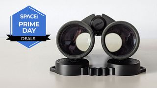 A head on view of the objective lenses of the Nikon Prostaff P3 10x42 binoculars with a blue Space.com Prime Day badge in the upper left corner.
