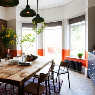 kitchen with dining set and wooden flooring