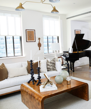 A living room with a grand piano.