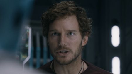 Chris Pratt's Star-Lord wearing a t-shirt and necklace talking about Rocket in Guardians 3. 