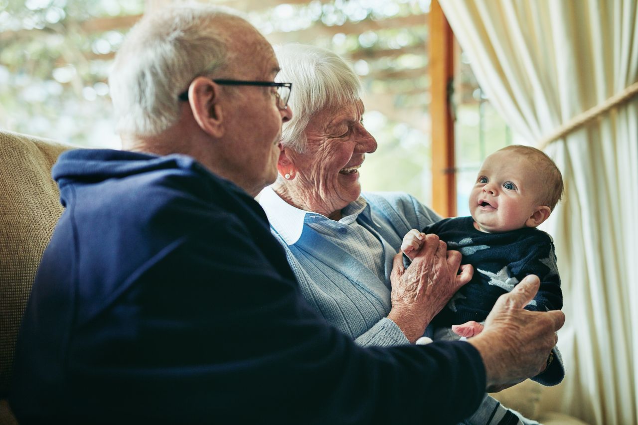 Shot of grandparents bonding with their little grandson at home