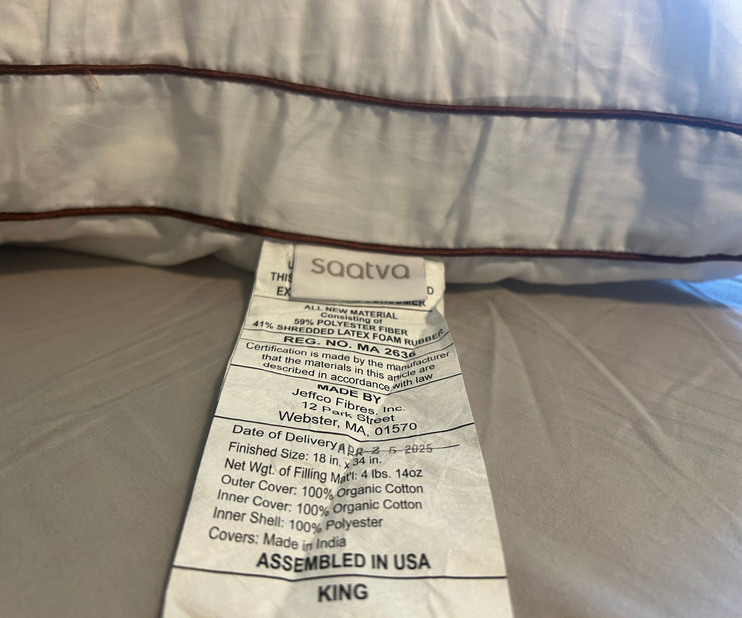 Images of the Saatva Latex pillow close up and from the side to demonstrate testing for a review