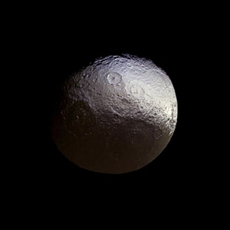 This image taken by the Cassini spacecraft shows what the two-tone surface of the moon Iapetus looks like without false color. Cassini examined Iapetus for about a week in early 2015, in a campaign partly dedicated to further investigating subtle color differences within the moon's bright terrain.
