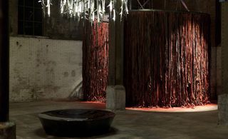 The 11-m-long patchwork curtain offers glimpses of what's beyond. In one corner there's a labyrinth of shredded tyre inner tubes that visitors navigate as if pushing through a carwash