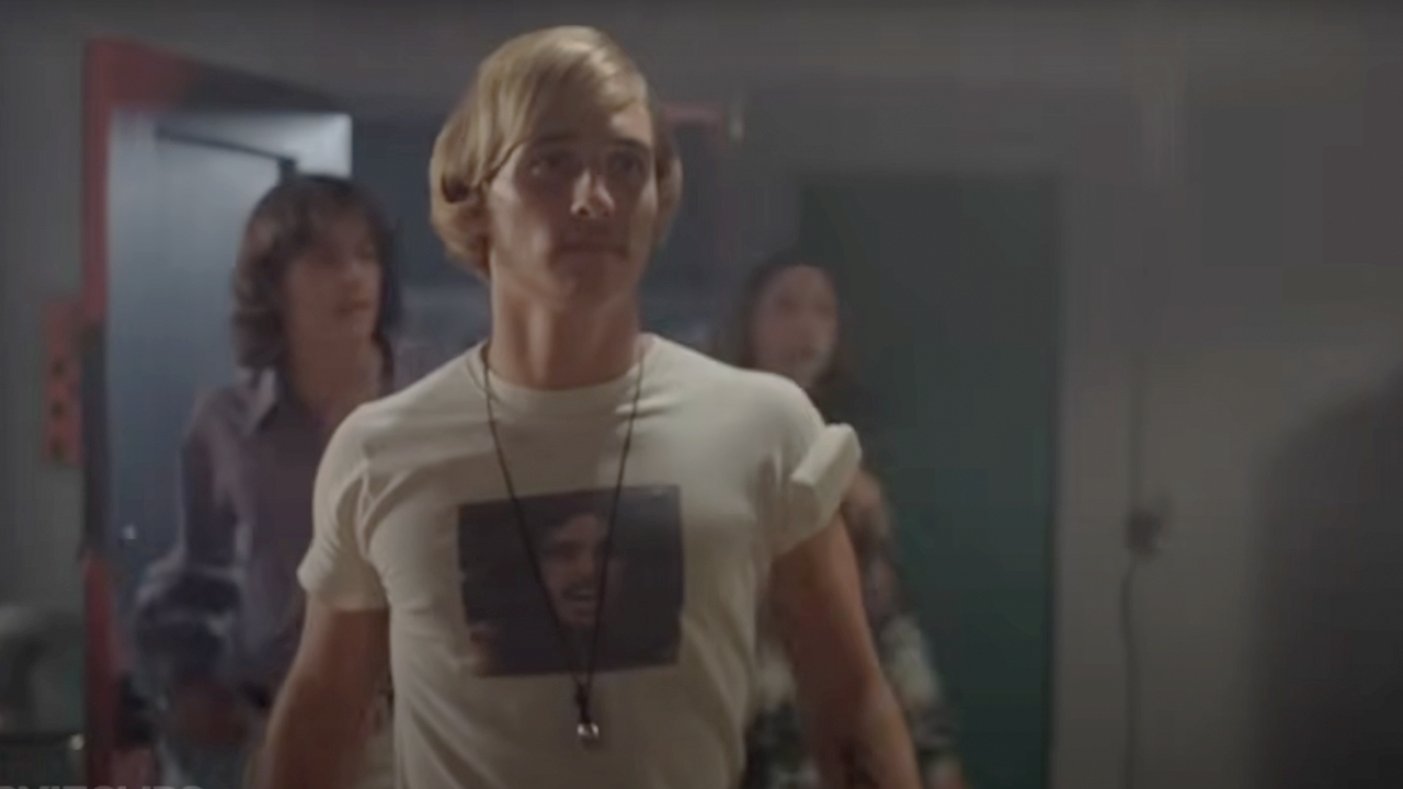 Matthew McConaughey wearing a Bob Marley T-Shirt and walking into a room in Dazed and Confused
