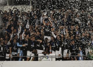 PAOK Thessaloniki players celebrate their Greek Cup final win over AEK Athens in May 2019.