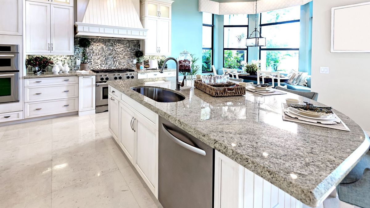 Classic style kitchen with granite worktops and stone floor tiles