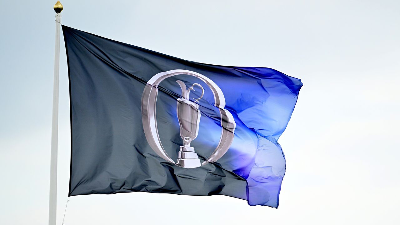 A blue Open Championship flag flying in the wind