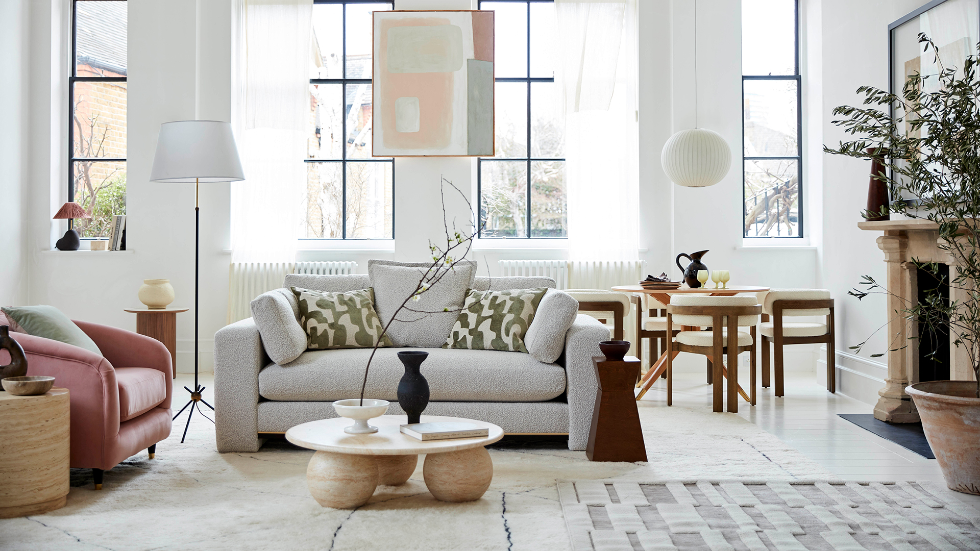 white quiet luxury living room with a marble coffee table with round feet