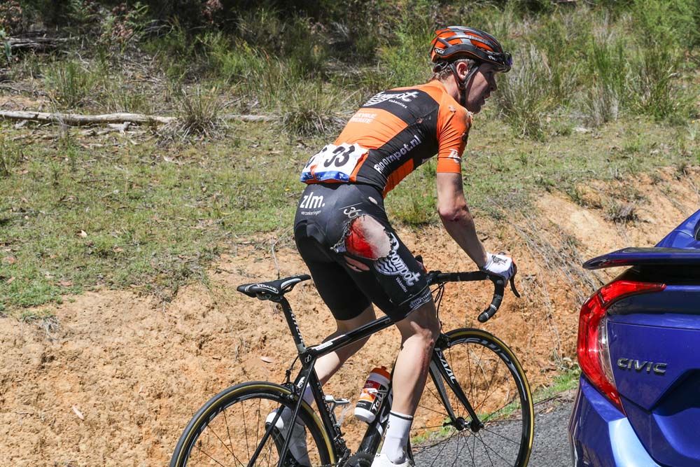 A Roompot - Nederlandse Loterij gets back on his bike after a heavy fall