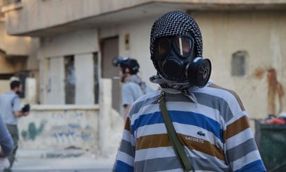 Syrian activist with gas mask