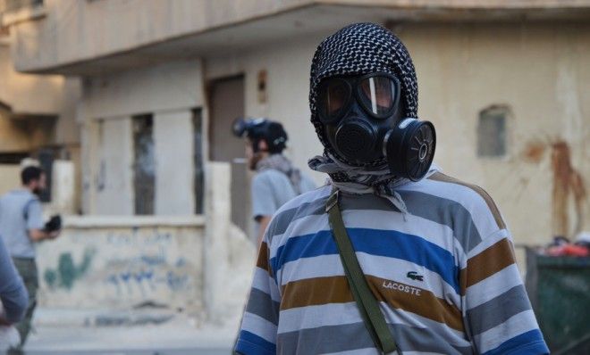 Syrian activist with gas mask