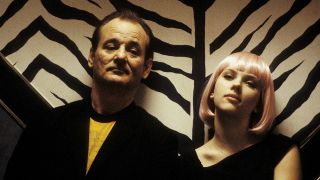 Bob and Charlotte sit next to each other on a bench in Lost in Translation