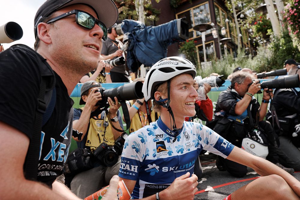 Adrien Costa and Axeon Hagens Berman soigneur Jim Anderson watch Costa's rivals finish the final stage at the 2016 Tour of Utah
