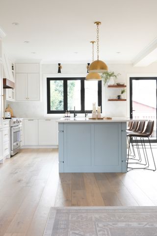 A kitchen with white oak flooring