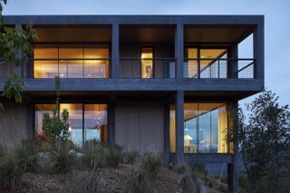exterior detail at dusk of Frame House by Mork-Ulnes Architects