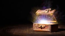 Treasure box half opened in a dimly lit room with magic lights coming out of the box