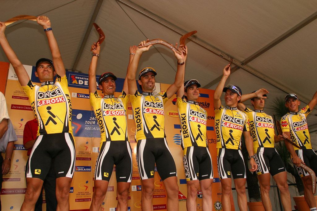 The ONCE-Eroski squad celebrate winning the 2003 team prize with their boomerangs on the podium