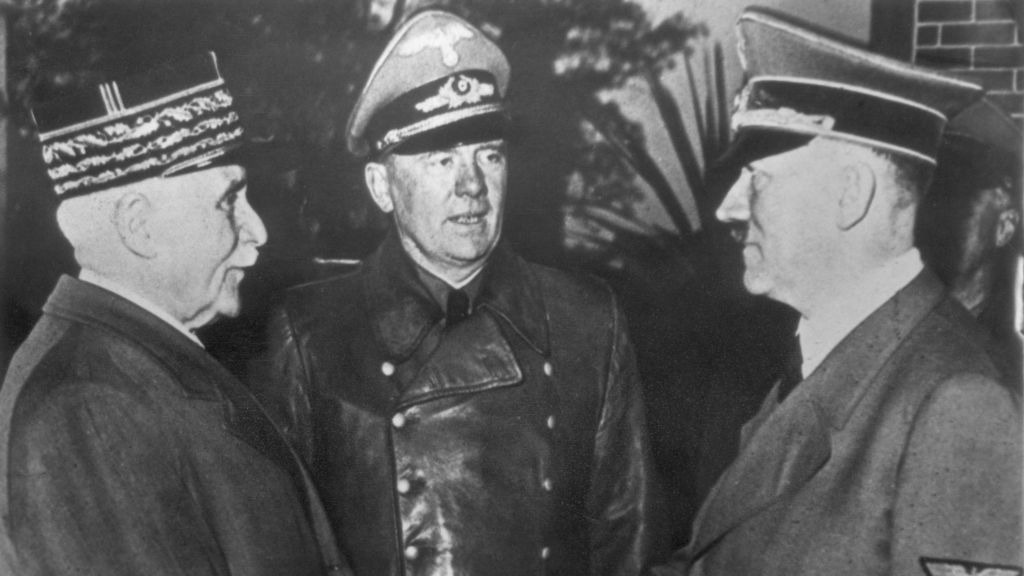 French Marshal and Vichy leader Henri-Philippe Petain and Nazi leader Adolf Hitler, share the famous 'handshake at Montoire'