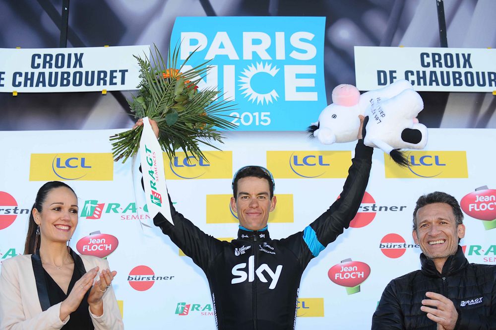 Richie Porte celebrates his win on the podium.