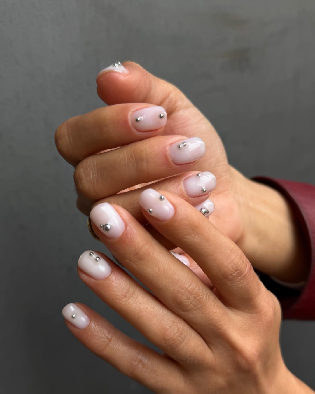 A milky white manicure by Oksana Zavora