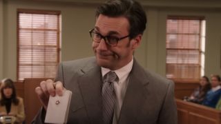 Jon Hamm holding a pocket bible in court on Unbreakable Kimmy Schmidt