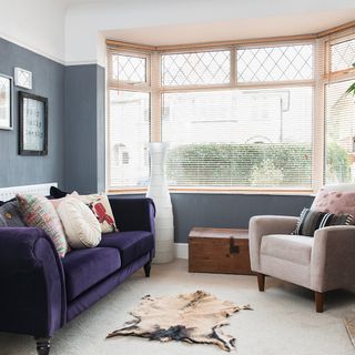 living room with purple sofa