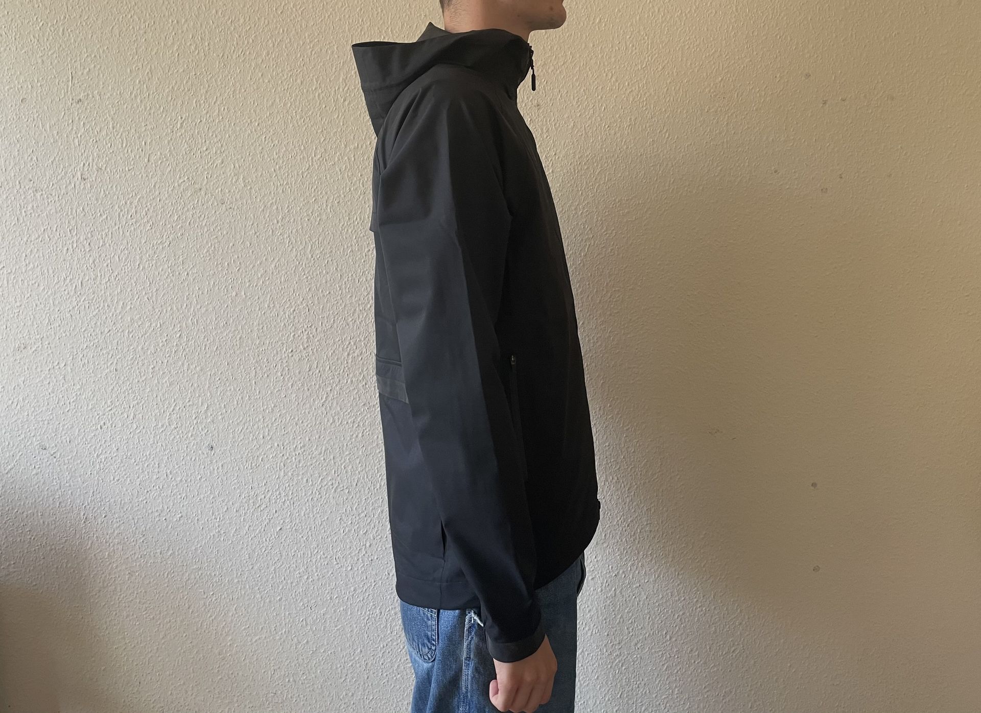 Person wearing black Chrome Storm Salute Commute Jacket
