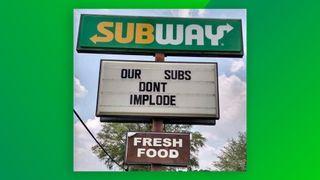 Subway billboard reading 'Our subs don't implode'