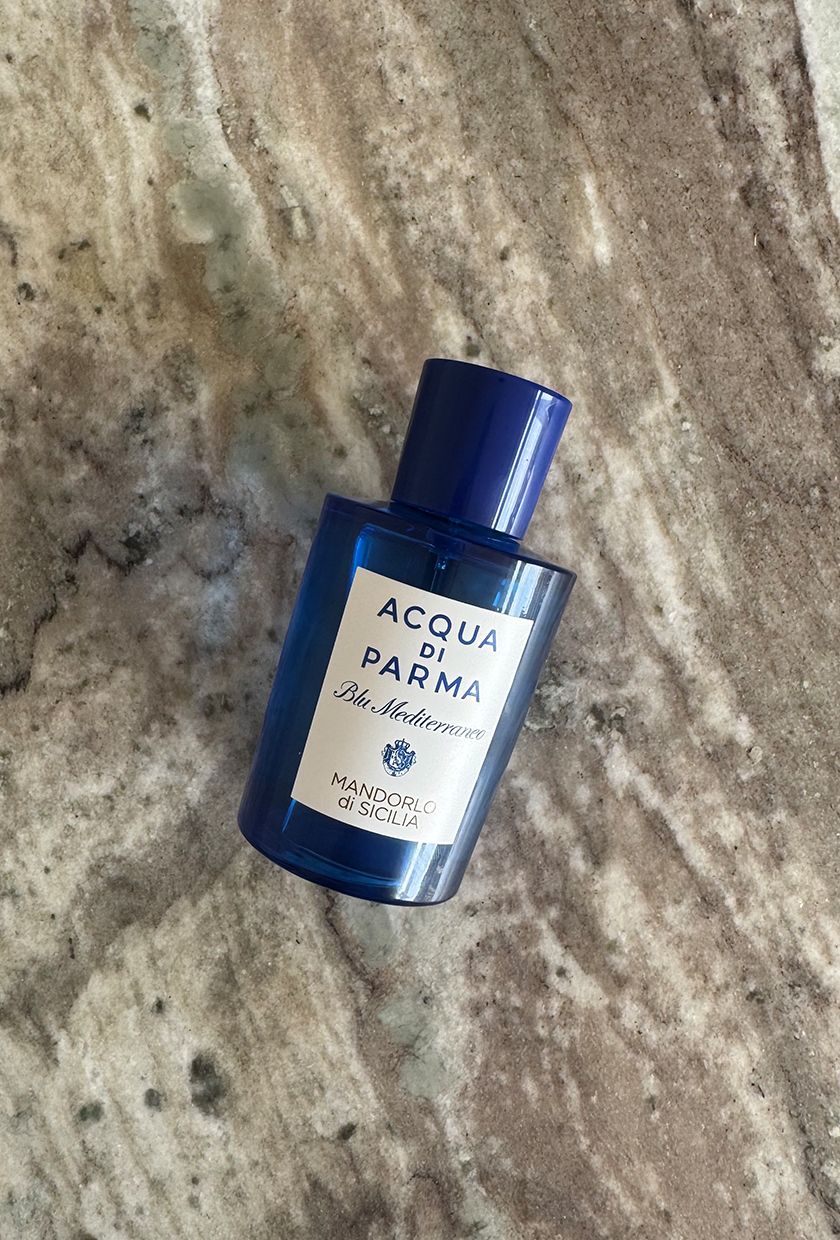 A photo of Acqua Di Parma Mandorlo di Sicilia perfume on a marble table