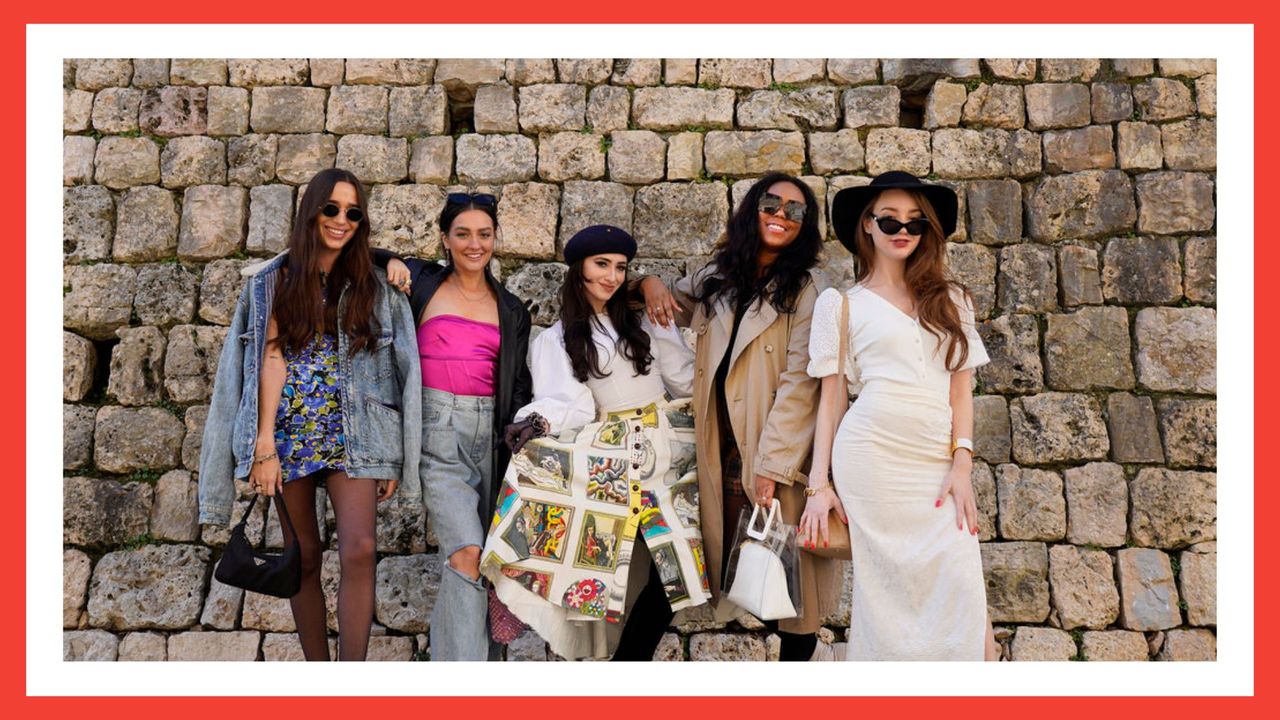 real girlfriends in paris cast posing outside against a brick backdrop