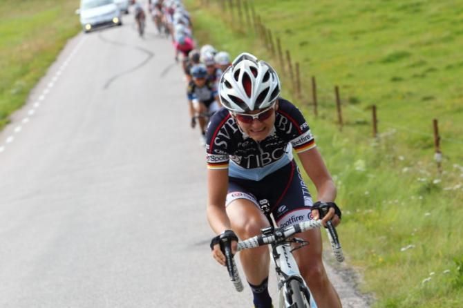 Claudia Hausler (Tibco) leads at speed on the climb