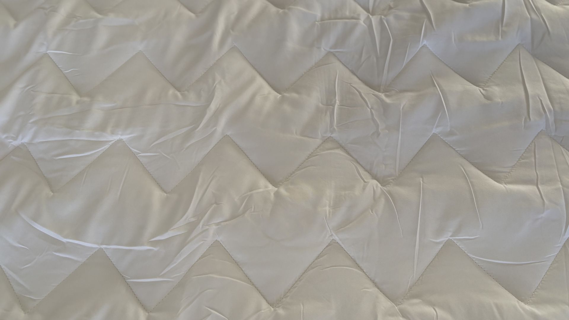 Testing the Fogarty Temperature Balance Mattress Protector on the bed