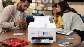 A family using a Canon inkjet printer