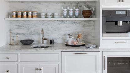 kitchen marble worktop in grey with small sink and shelving above