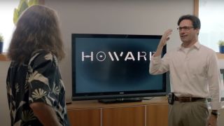 Larry David and Jon Hamm talking in front of a monitor in Clear History