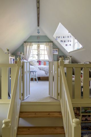 childrens room with white wall and stairs