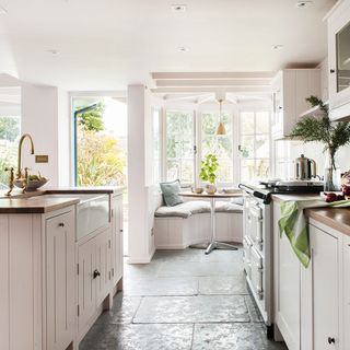 kitchen area with wooden worktop and cabinets