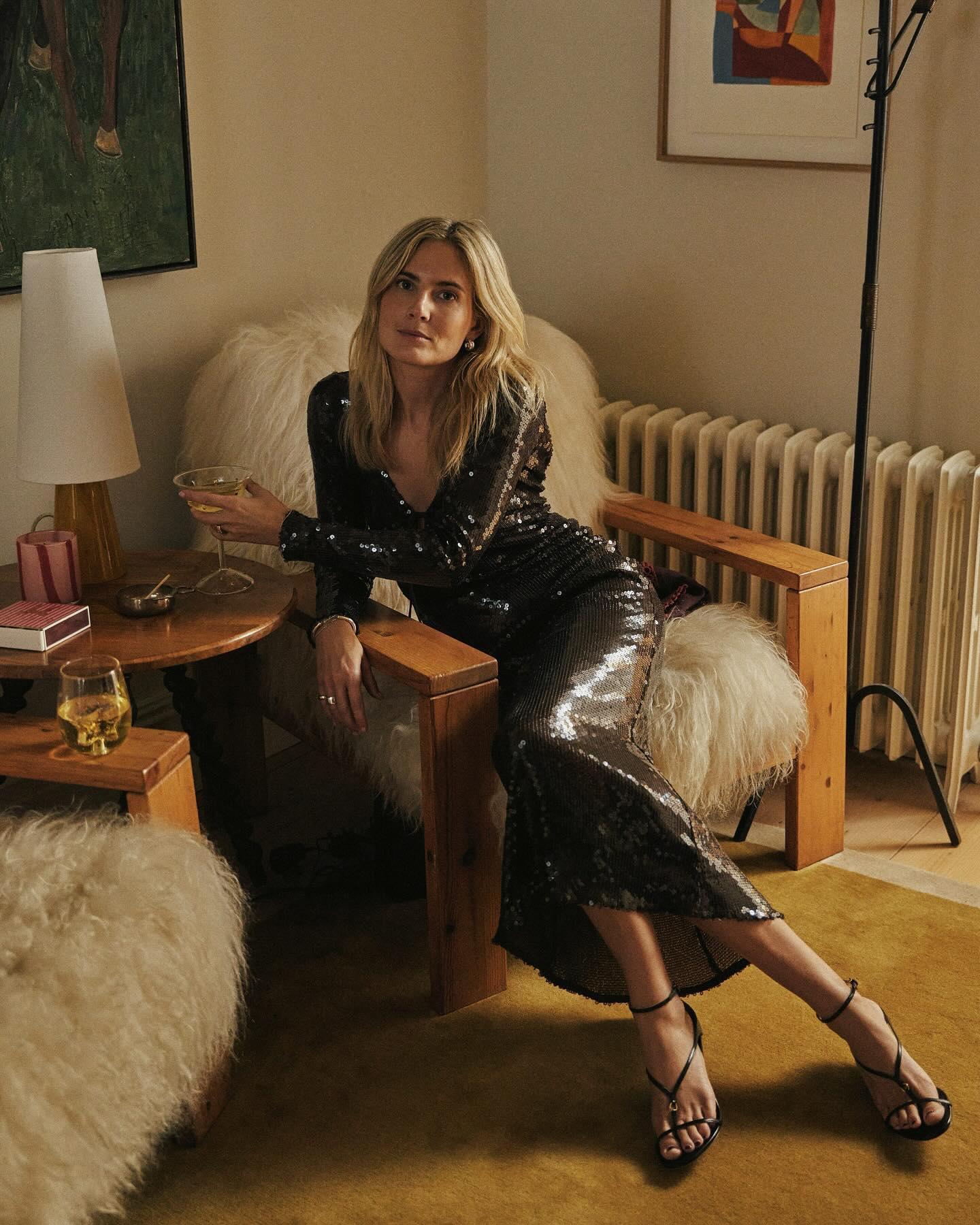 An image of @lucywilliams02 wearing a dark sequin wedding guest dress.