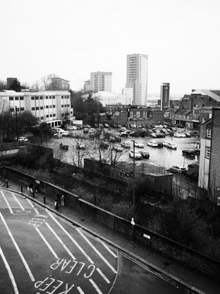 Mono image of a cityscape taken on the OM System OM-3 with the OM System M.Zuiko 17mm f/1.8 II