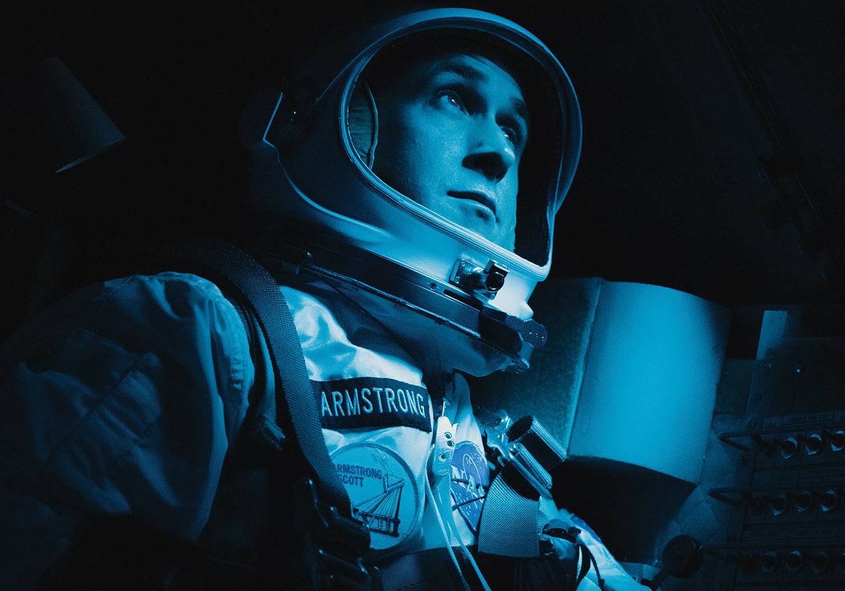 Ryan Gosling sits in the Apollo capsule