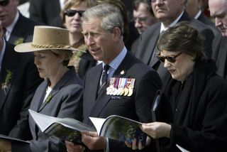 Prince Charles ( C) and Prime Minister of New Zealand Helen Clark (R) at Lone Pine Australian Cemetery during the Anzac Day ceremony