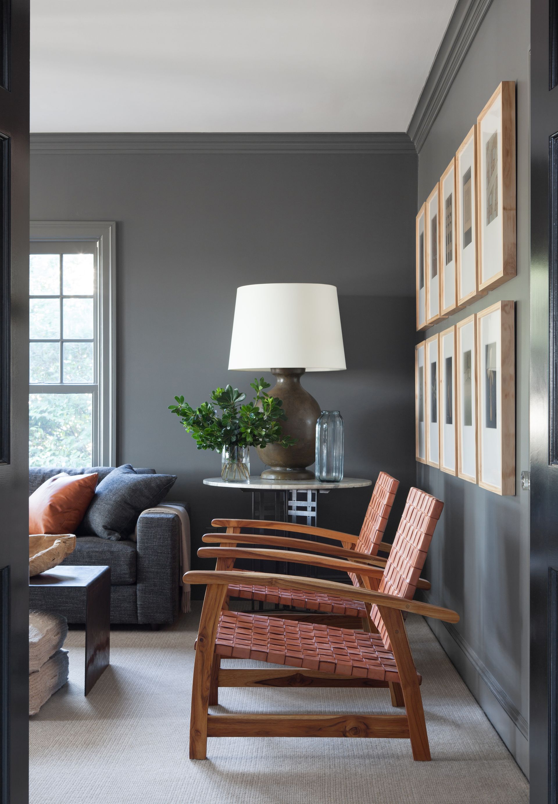 Two low wooden chairs in a living room