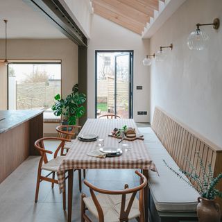 HUSK kitchen with bench seating and wishbone chairs