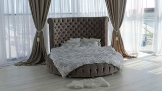 Grey round bed and bedding