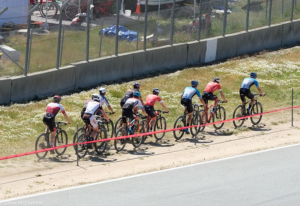 The leaders riding along the track mid-race