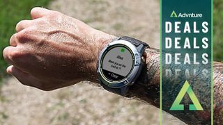 Mans wrist wearing Garmin Enduro watch