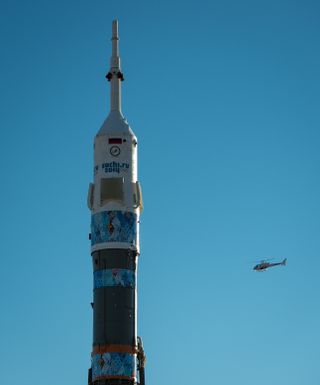 Helicopter Approaches Soyuz Rocket